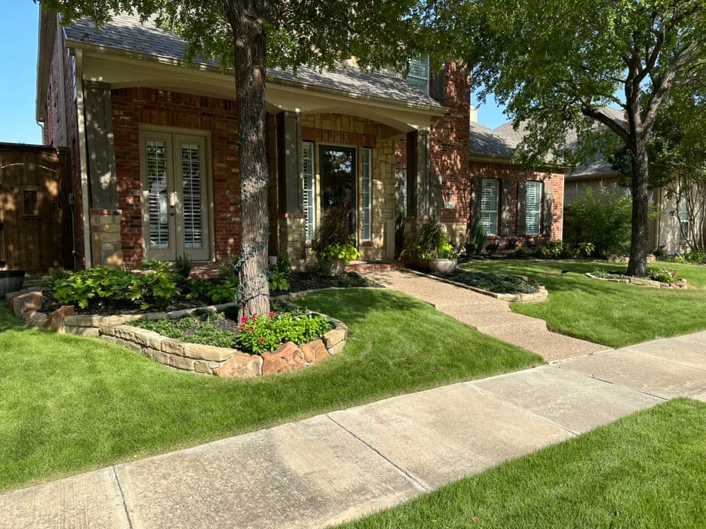 Beautiful suburban home with landscaped yard, brick exterior, and manicured lawns.